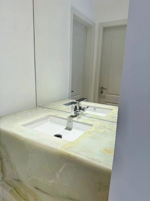 acheter La salle de bains en marbre vert Alpi Jade vert avec veines dorées Vanité online manufacture